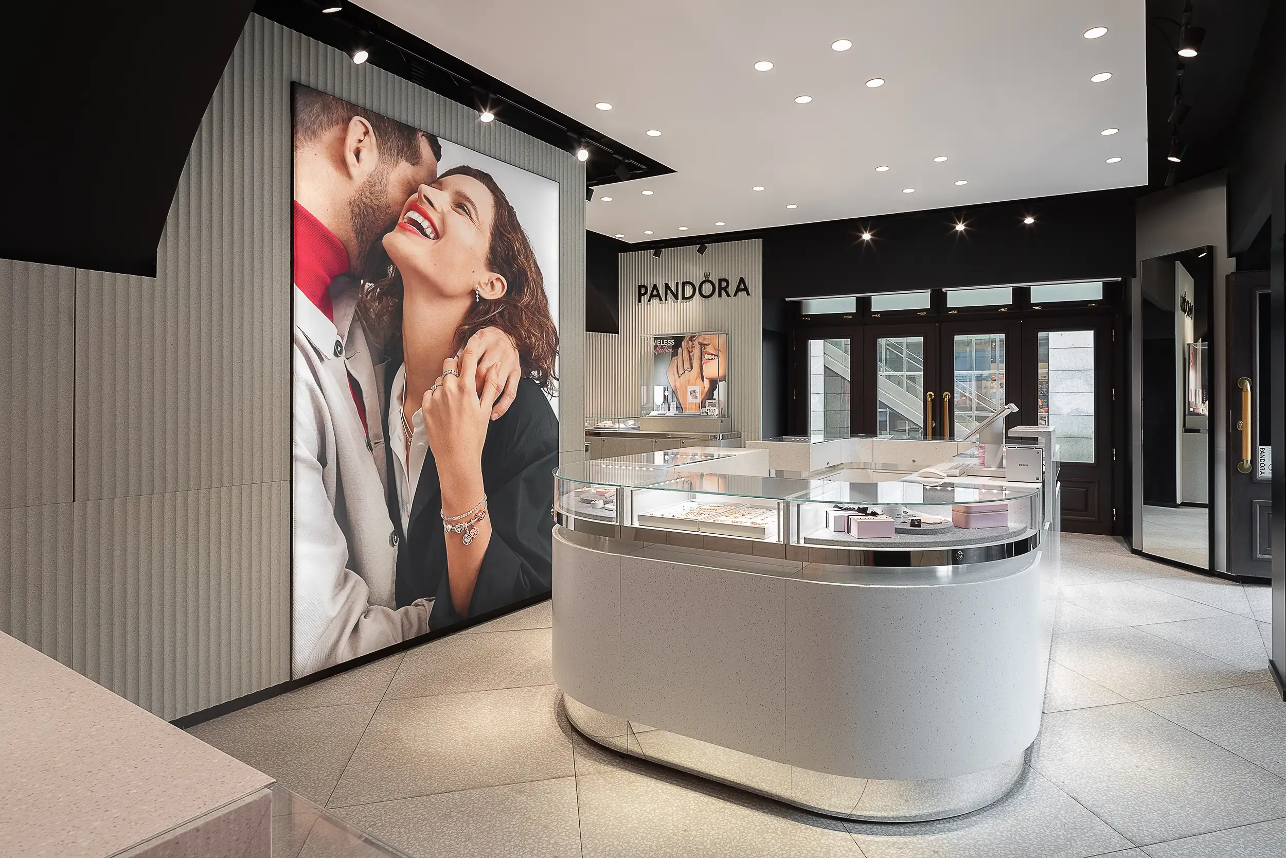 A wide angle photo showcases the interior of Pandora's jewelry store at Prague Wenceslas Square.