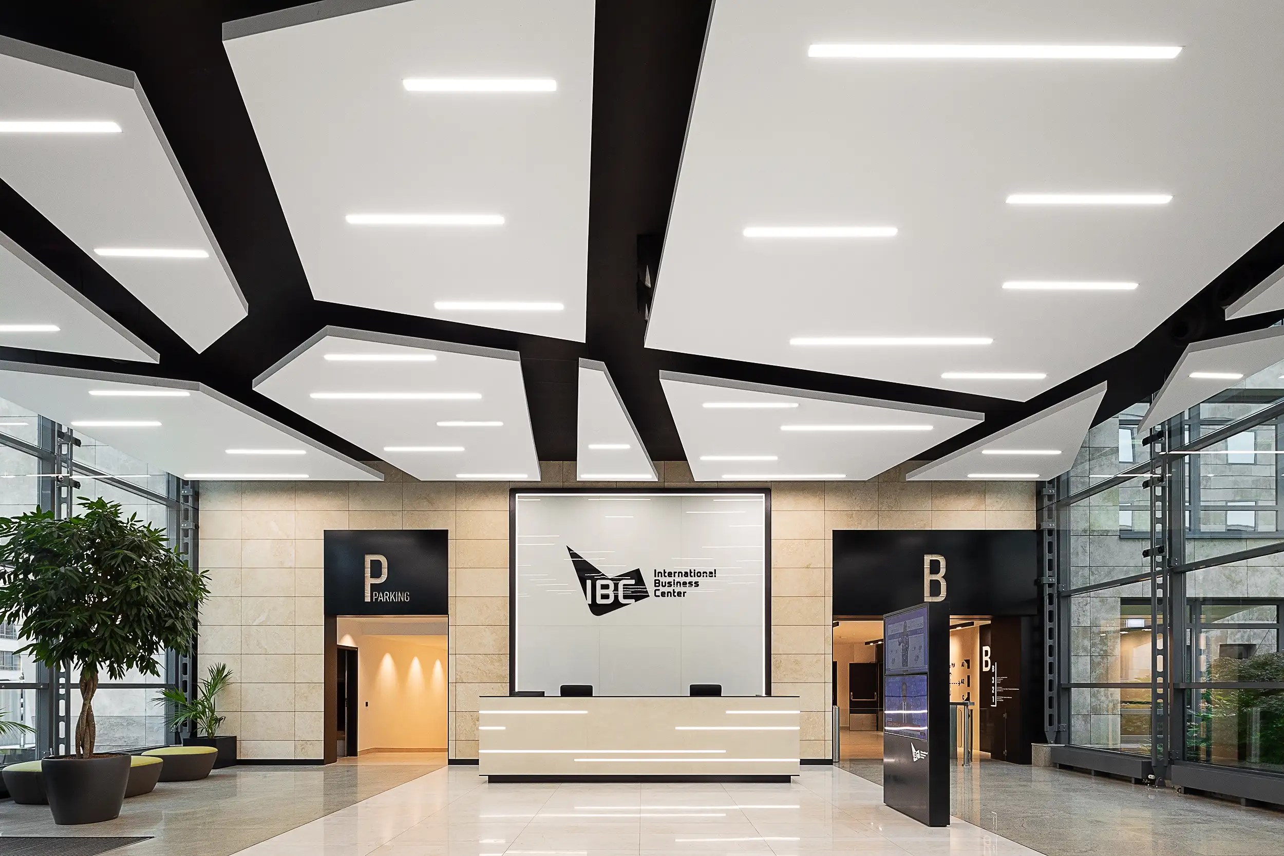 Photo of the newly renovated interior lobby and reception area of the International Business Centre (IBC) in Prague, Czech Republic, focuses on a high ceiling covered with designer acoustic panels in a tavern of ice floes.