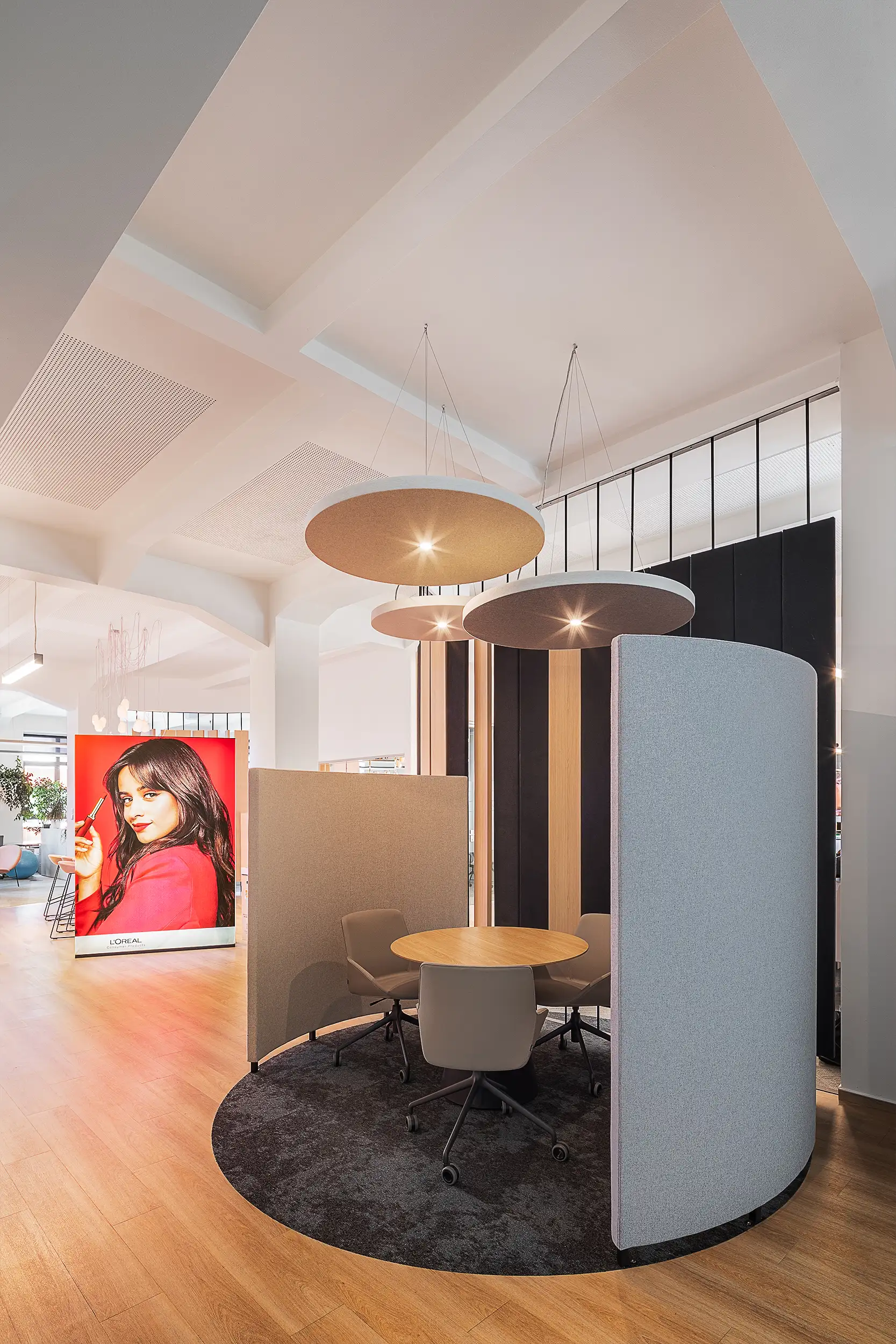 Photo of a small open meeting space in the L'Oréal offices at Křižík Palace in Anděl, Prague, Czech Republic.