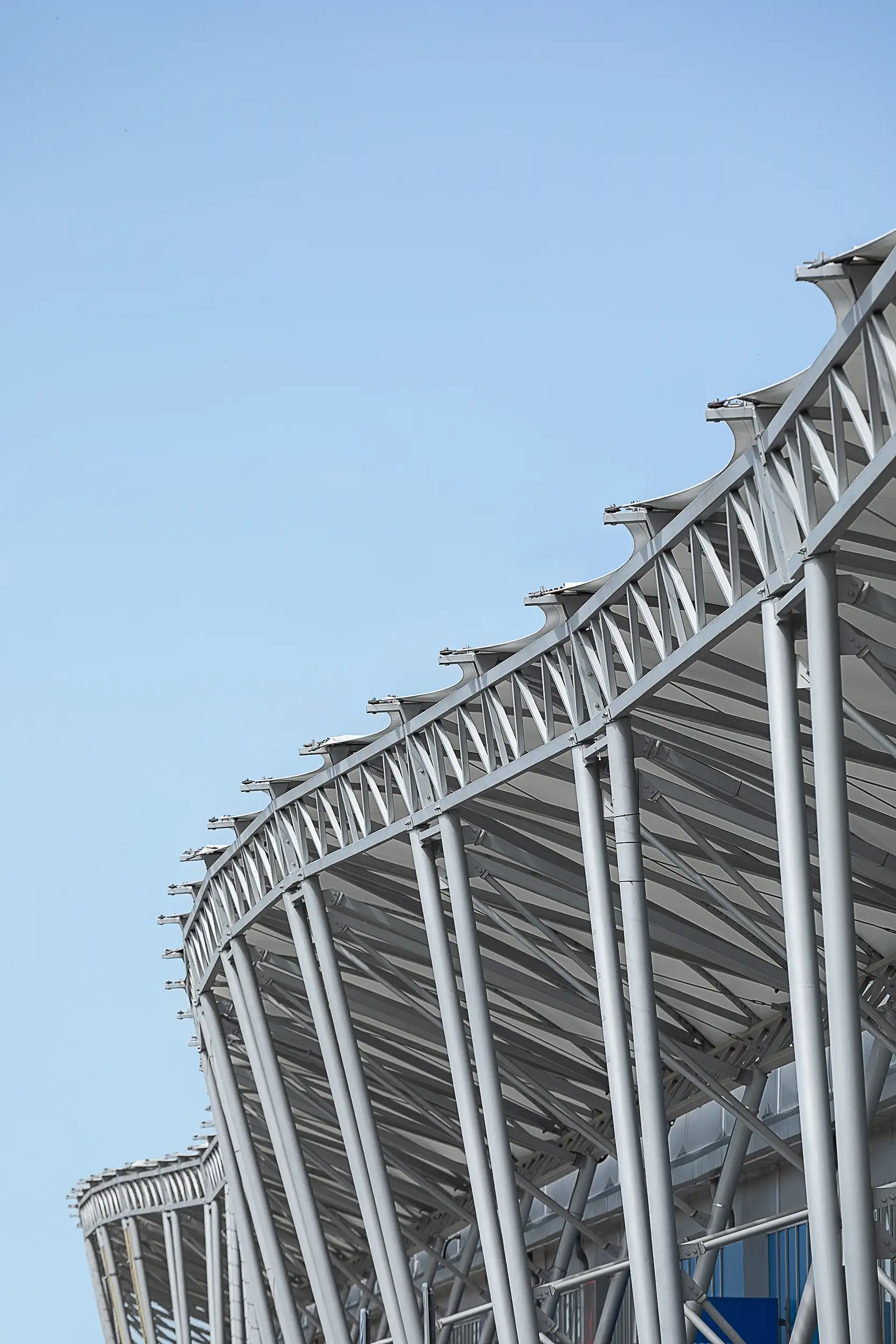 Detail of the wave-shaped metal roof structure over the entrance arcade of the Trnava MALL retail center in Slovakia.