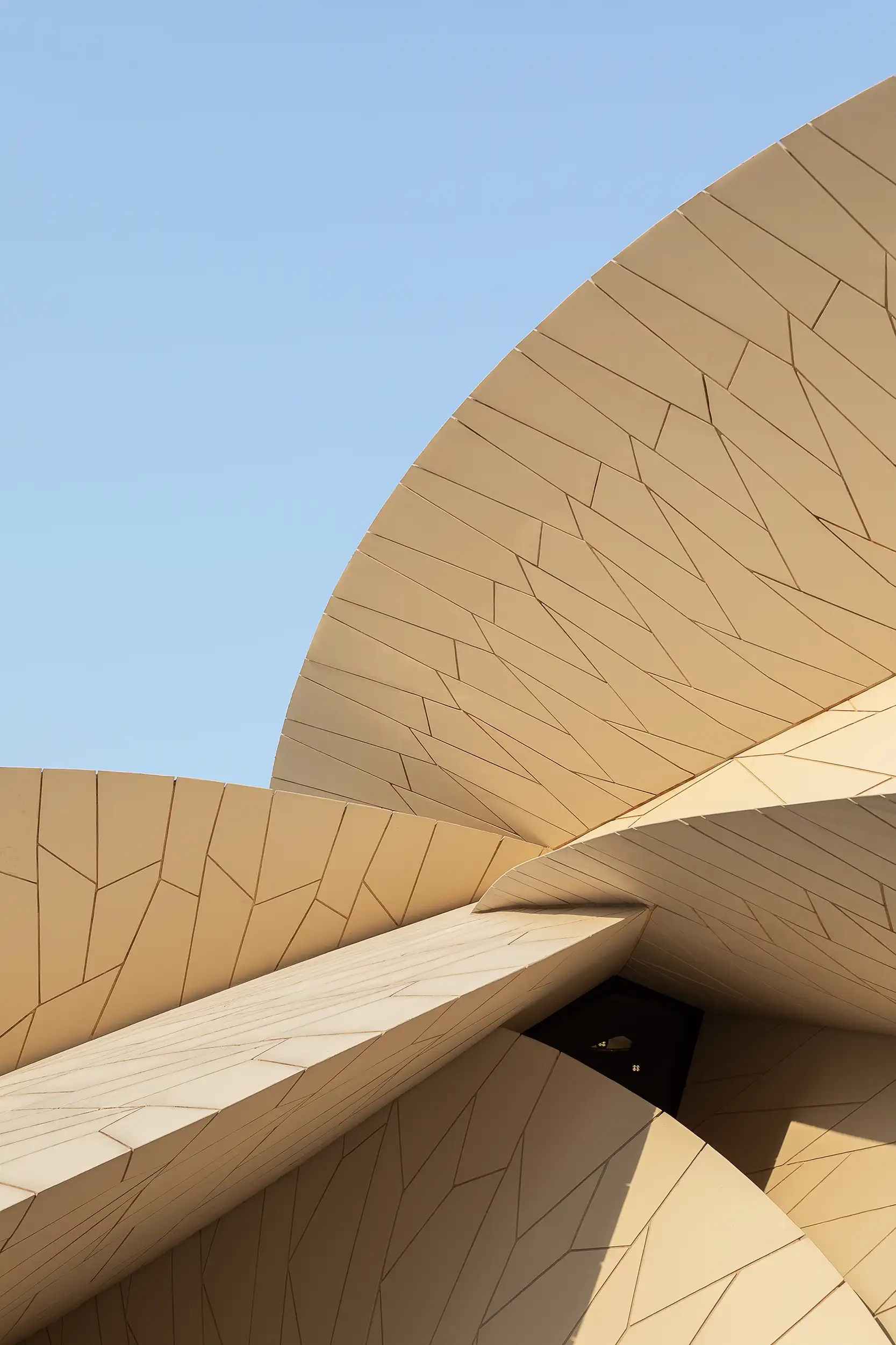 Detail of the clash of structural membranes/disks on the façade of the Qatar National Museum.