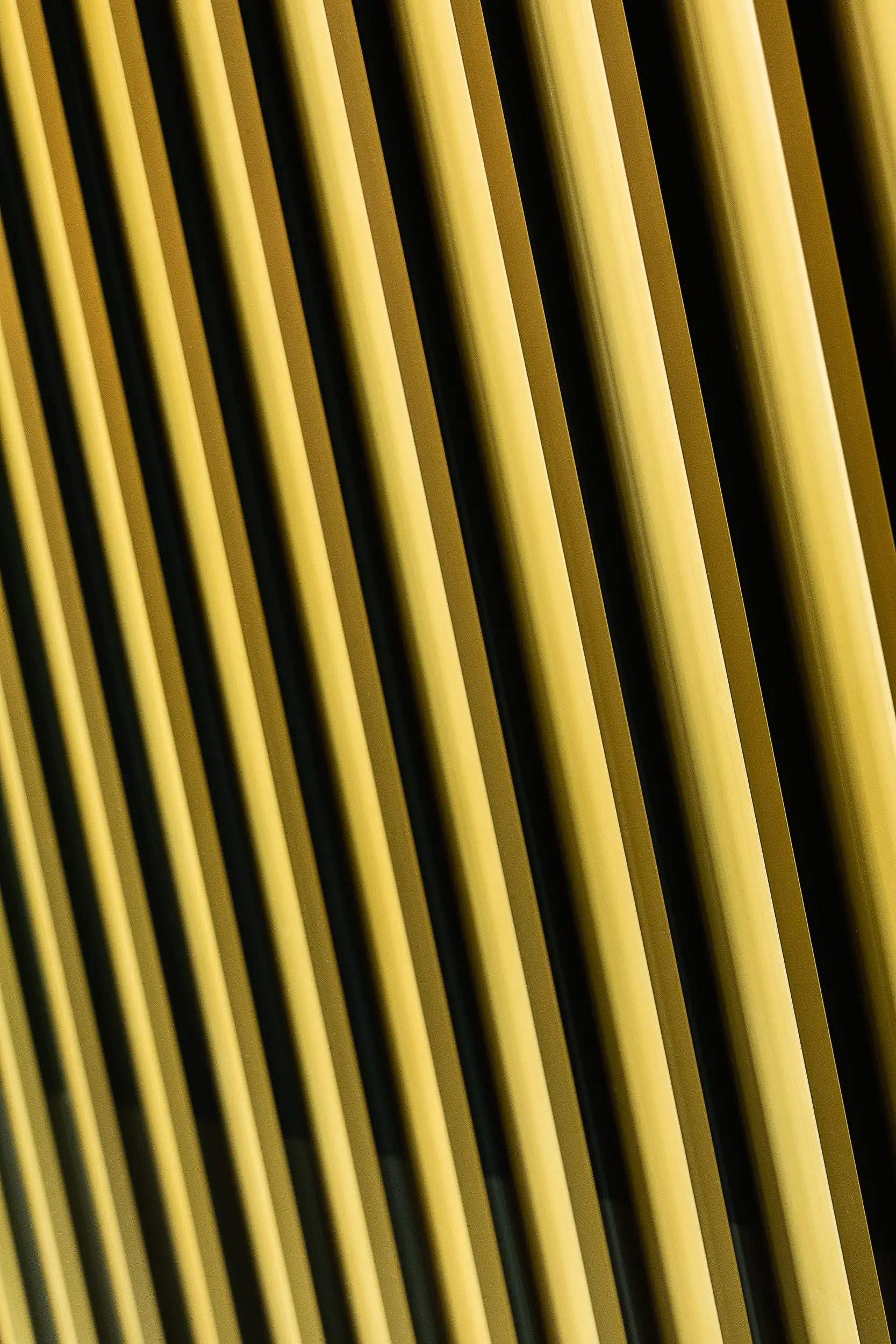 A close-up photo captures the significantly golden cladding covering the tower of the Euro Palace on Prague's Wenceslas Square.