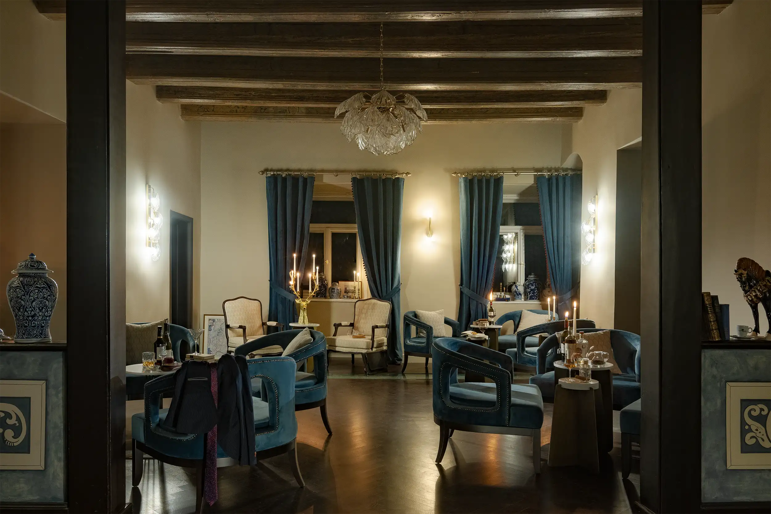 Stylish castle style hotel bar seating area in night and moody atmosphere.