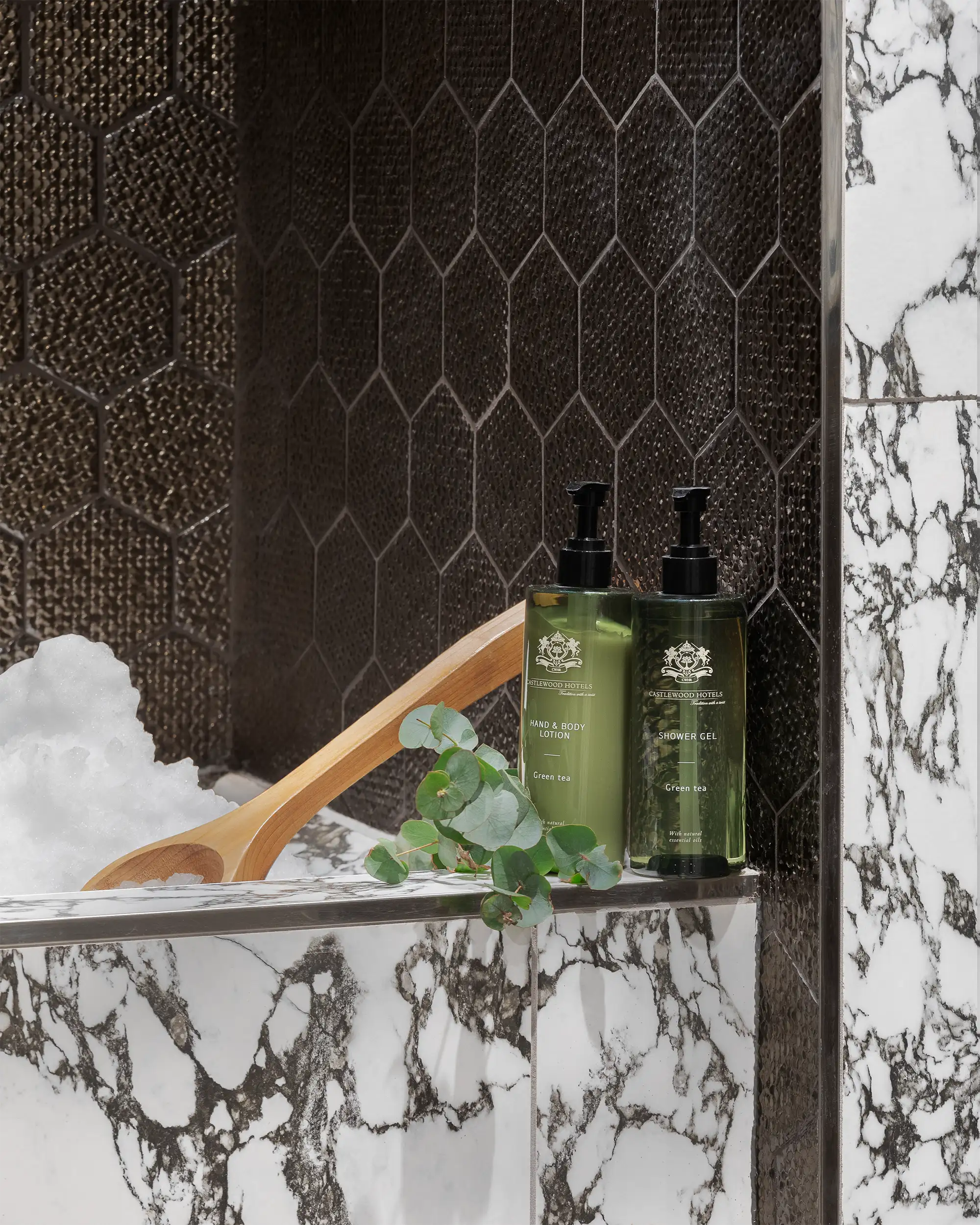 Detail of hotel shower gel and hand and body lotion captured in wellness centre.